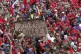 Supporters of President Nicolas Maduro hold up an anti-US ba