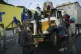 Anti-government protesters stop a truck while blocking a hig