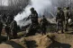Indian army soldiers arrive near the wreckage of an Indian a