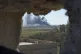 Columns of black smoke billow from the last small piece of t