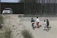 A group of asylum seekers attempt to cross the border betwee