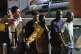 Migrants disembark from an Italian finance police boat at th