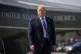 President Donald Trump walks on the tarmac to board Air Forc