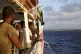 Migrants on board the Open Arms see Lampedusa's coastline ah