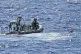 Italian Finance Police rescue a migrant who jumped off the S