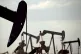 Pumpjacks work in an oil field near Lovington, New Mexico