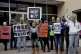 Protestors chant outside of the Bastrop County courthouse du