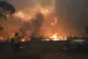 Rural Fire Service crews engage in property protection of a 