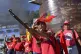 A member of the Bolivarian National Militia brandishes a rif