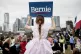 Lily Barbour, 5, holds up a campaign sign for Democratic pre