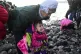 A child cries as migrants arrive at the village of Skala Sik