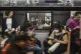 Commuters wear face masks as a precaution against the COVID-