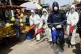 Workers wearing protective gear spray disinfectant as a prec