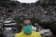 A member of a cultural center wears a mask to protect himsel