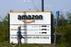 A man walks at the entrance of Amazon, in Douai, northern Fr