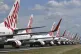 Grounded Virgin Australia aircraft are parked at Brisbane Ai