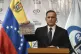 Venezuela's Attorney General Tarek William Saab holds a phot