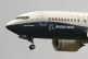 A Boeing 737 Max jet prepares to land at Boeing Field follow