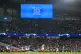 A big screen shows Manchester City's Raheem Sterling's goal 
