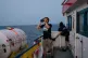 Sea-Watch 3 crew members search the horizon for refugee boat