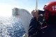 A crew member on the Aita Mari looks for refugee boats in th
