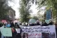 Women hold a sign demanding 'bread, work, and freedom' at th