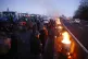 Farmers light fires as they block a highway near Ableiges, n