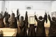 Iranian school students protest with a sign reading ‘Woman