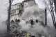 Rescuers work at the scene of a building damaged by Russian 