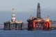 An oil platform standing amongst other rigs that have been l