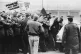 An miner pounds the roof of a car at the gates of Bilston Co
