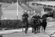 Police officers march through a mining town