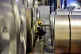 A worker inspects rolls of steel at Tata Steel's Wednesbury 