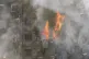 Smoke billows out from the 24-storey Grenfell Tower
