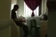 A young boy sits in his cell in a youth offender's instituti