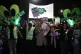 People take part in a silent walk to mark the six month anni
