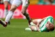 Celtic's Scott Brown rolls on the floor after being challeng