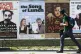 A man walks past posters advertising shows at the Edinburgh 