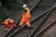 Network Rail staff tend to a railway line in July 2018