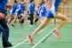 Students run during a Physical Education (PE) lesson inside 