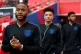England and Man City's Raheem Sterling (left) walks onto the
