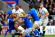 England's Joe Cokanasiga powers through the Italian defence 