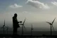 A workman by a wind turbine at the Braes of Doune windfarm n