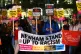 Anti-racism campaigners attend a vigil outside the Home Offi