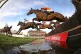 Runners and riders over the water jump in The Sir Peter O'Su