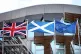 The Union flag, Saltire and the European Union flag fly alon