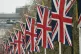 Union flags line The Mall leading to Buckingham Palace