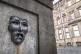 A bronze theatre mask on Edinburgh's Royal Mile