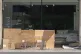 A cardboard homeless shelter outside a furniture store in To