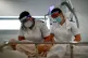 Radiologists Emma Parker and Gemma Ainsworth prepare a patie